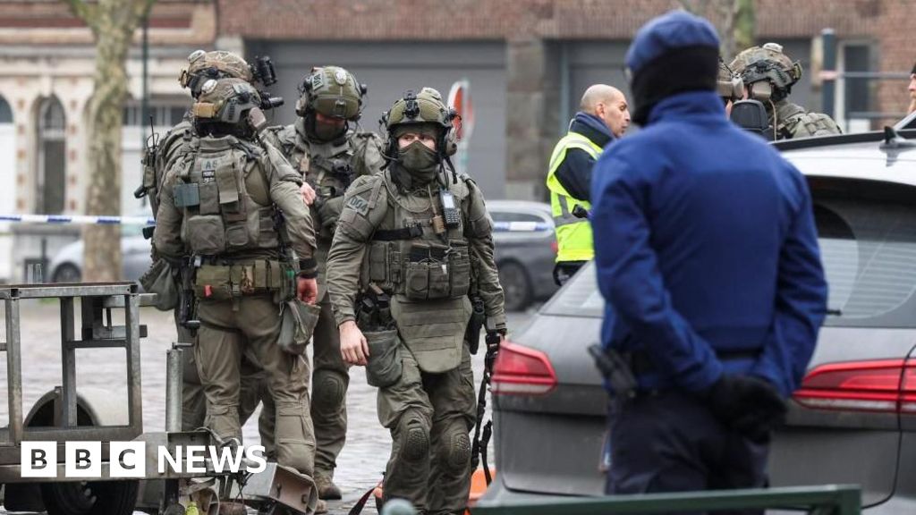 Belgian police hunt for gunmen after Brussels shooting