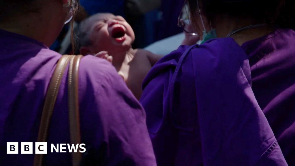 Moment baby is born on Bangkok street after quake evacuation